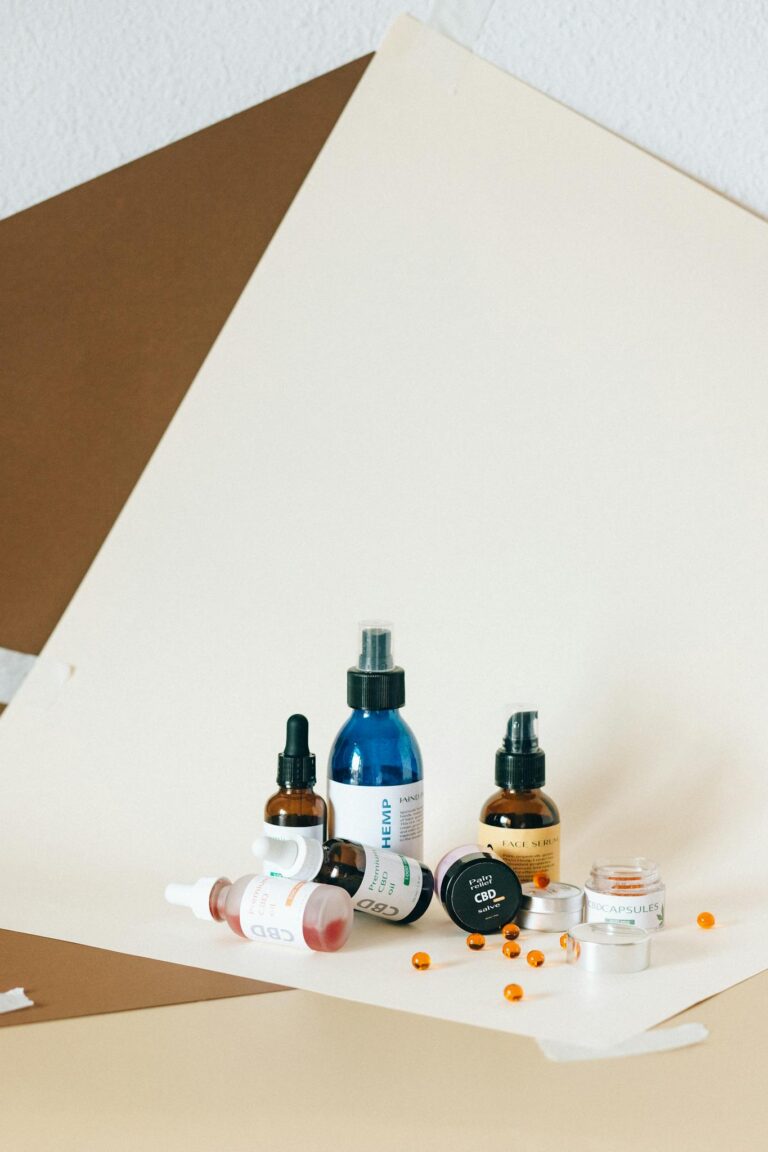 A creative layout of various CBD and hemp products including bottles and oils.